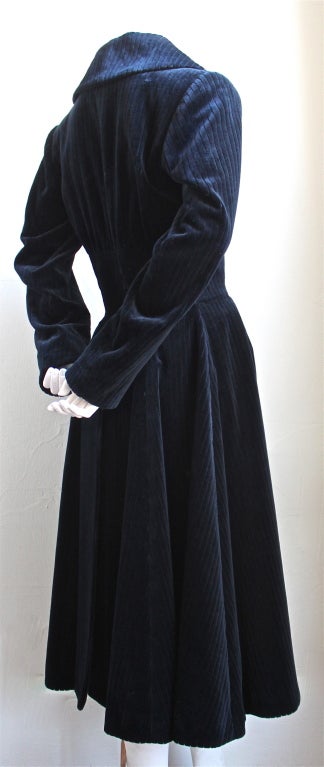 Midnight blue wide wale velvet coat with corset waist from Azzedine Alaia dating to the late 1980's. Coat best fits a size 4. Fully lined. Pockets at hips. Made in France. Excellent condition.