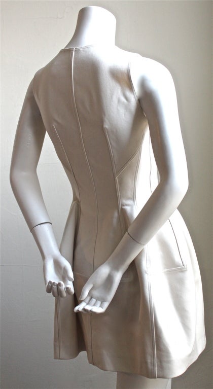 Gorgeous off-white tulip dress with silver zipper from Azzedine Alaia dating to fall of 2011/2012. Dress is labeled a French 42 however this dress runs extremely small and best fits a size 4 (33