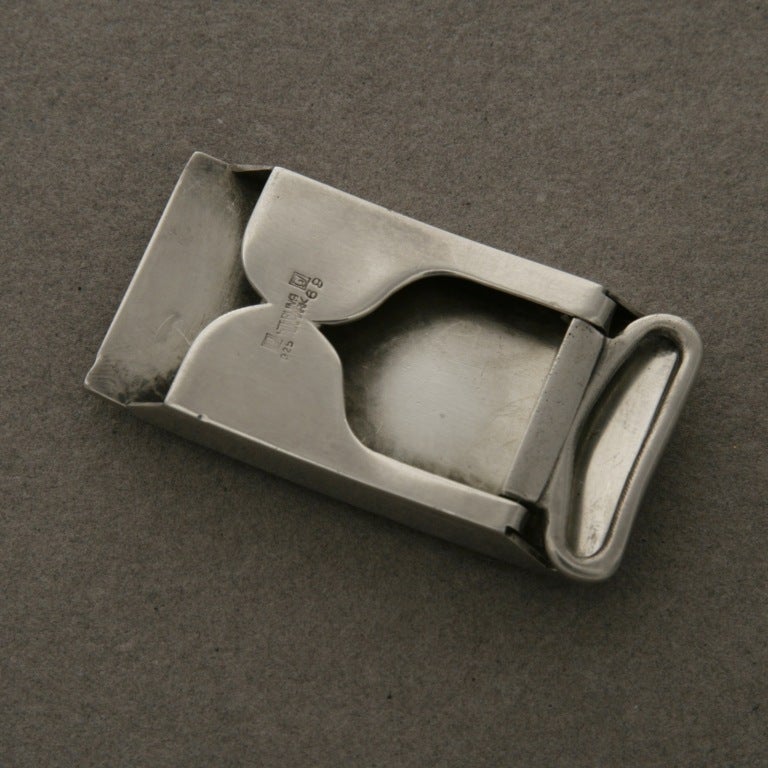 Stunning Art Deco design. Fits a smaller sized belt. Very heavy.
