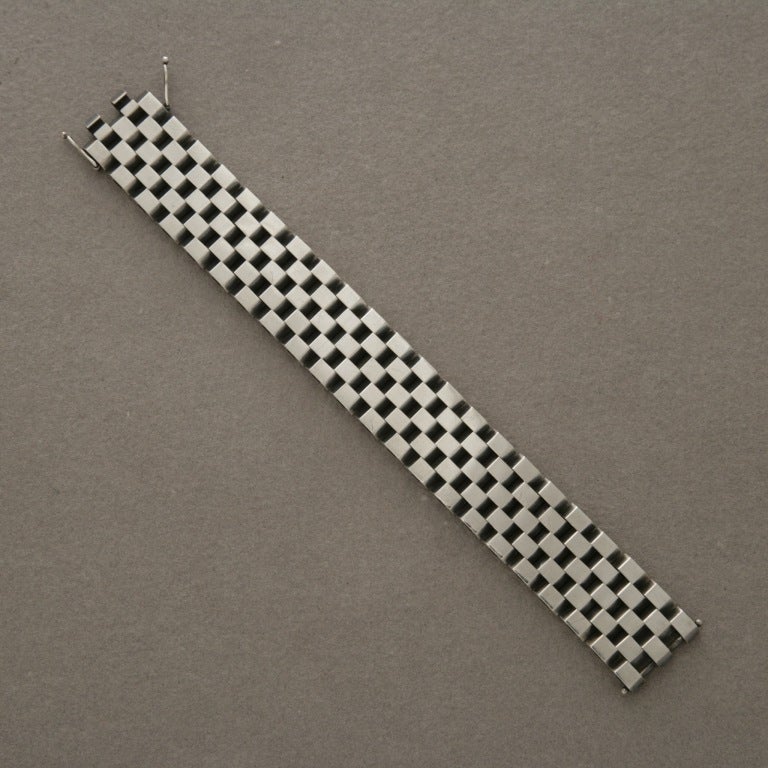 Very rare, spectacular checkerboard visual created by intricate, alternating squares of sterling silver. This bracelet lays smoothly and shapes beautifully to the wrist.

This was designed in 1969 and has english import marks as well as the Georg