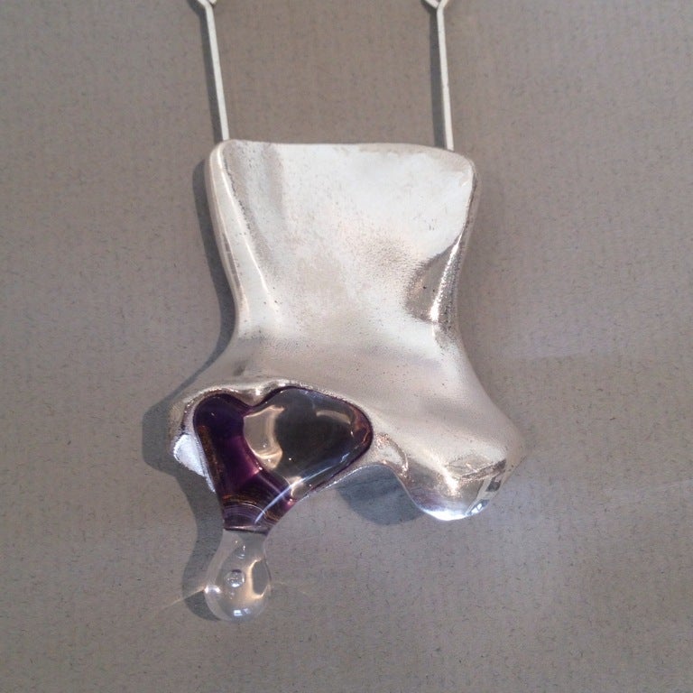 Unique sterling silver pendant in satin finish with acrylic drop, characteristic of Weckström's  space designs. Featured on a matching hand-made sterling silver chain, measuring 26 inches. Drop measures 2.75 inches. 

Complimentary gift box and