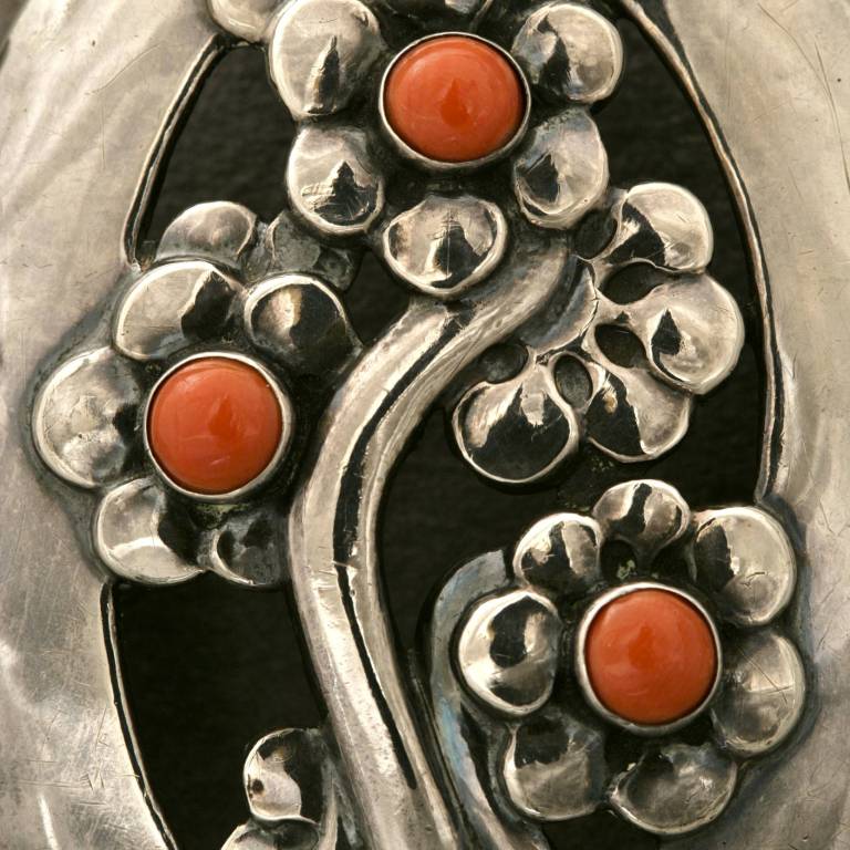 Georg Jensen large belt buckle with bright lively coral cabochons, circa 1908-1915. This was likely the prototype as it is un-numbered but fully hallmarked. Designed by Georg Jensen and put into very limited production as design no. 35 in