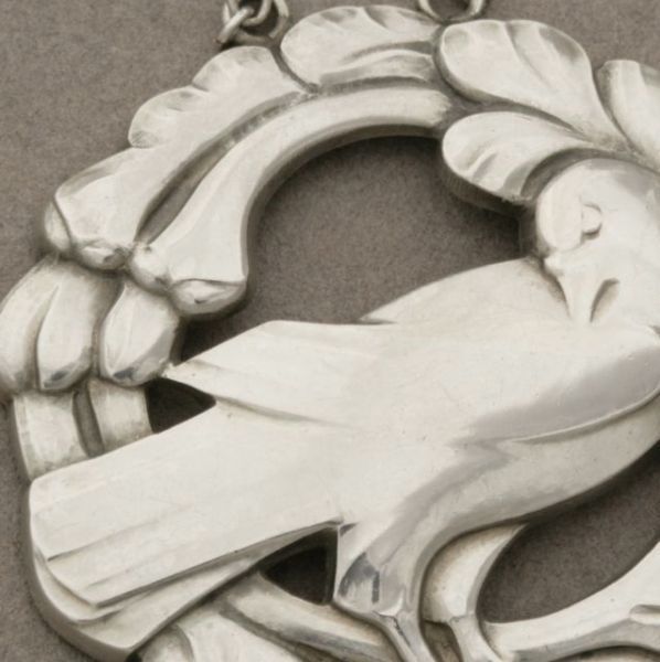 Georg Jensen sterling silver bird pendant, no. 70. Toggle clasp allows adjustment in length on original link chain. Excellent vintage condition. Designed by Kristian Mohl-Hansen circa 1933 - 1944. Chain measures 24 inches.
