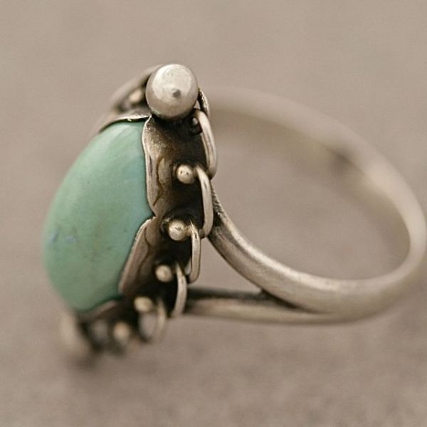 Georg Jensen sterling silver ring no. 24 with turquoise cabuchon stone. Beautiful color. Fits a size 6.