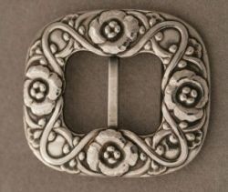 Very rare Georg Jensen belt buckle of impressive scale. Entirely hand wrought with exceptional detail. Designed circa 1915 and produced during the same period with hallmarks from the period. 830 silver.
Very few Georg Jensen belt buckles were ever