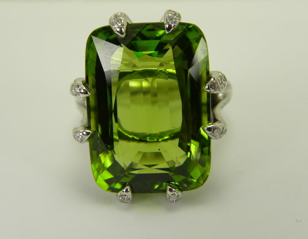 18K white gold. Peridot weight is 18.79 carats. 84 diamonds total weight is 0.72 carats. Size 6.75