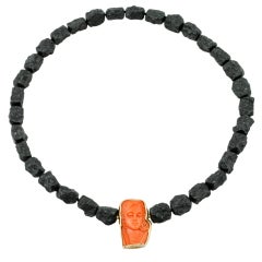 Antique carved coral set in 18kt gold custom mounting Antique carved coral set in 18kt gold custom mounting