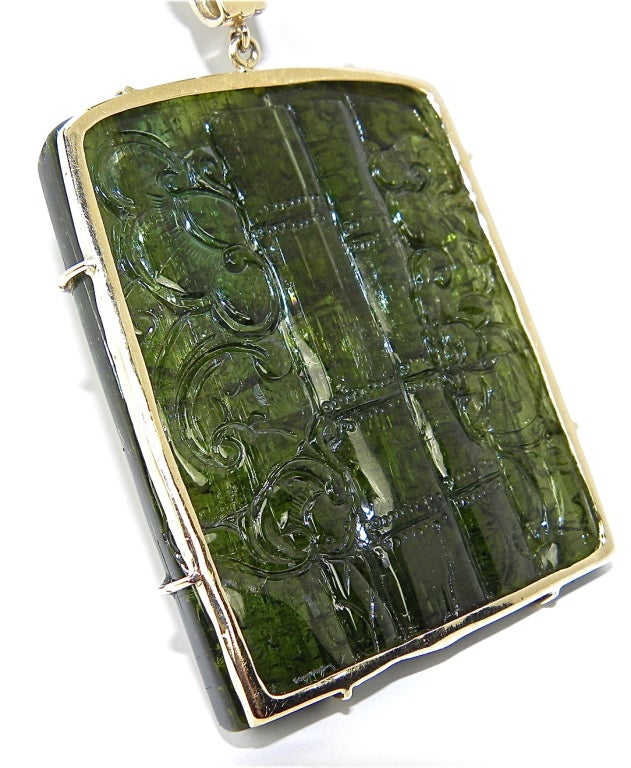 important carved green tourmaline pendant