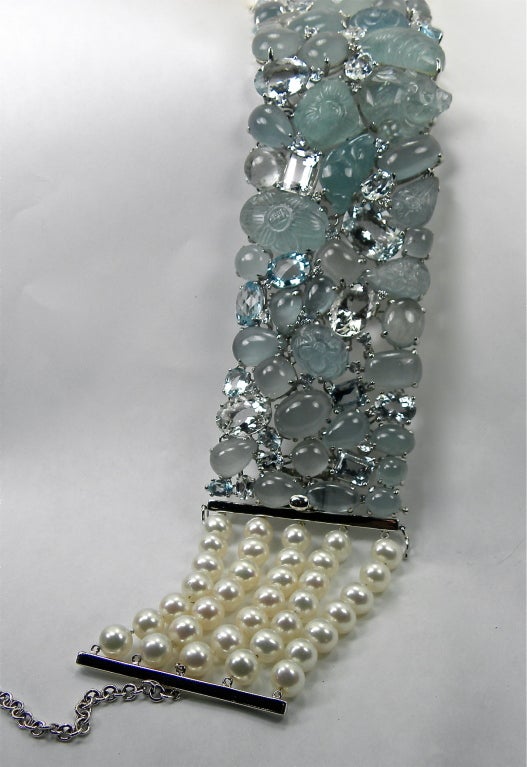 18 white gold Aquamarine and pearl choker and bracelet . removable pearl section makes it a fabulous bracelet 2 inches wide , 11.5 inches in length , 76 aquamarines 381c and  diamonds.40c, set on a removable 5 strands 7mm pearls