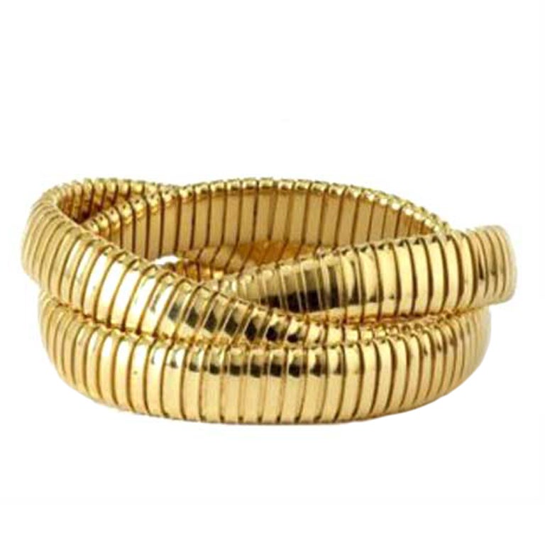 Yellow Gold Triple Strand Tubogas Flex Bracelet. For Sale