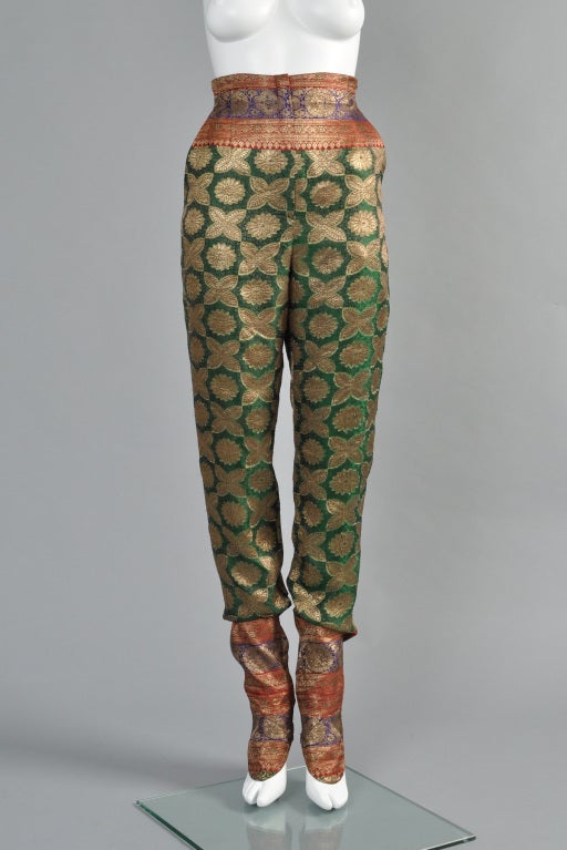 Spectacular early 1980s Norma Kamali/OMO silk brocade harem pants. INCREDIBLE piece! Ultra high waist with hidden front zipper, flared hips + super long, slouchy tapered legs. Multi-colored metallic silk brocade. Besom pockets. The best part of