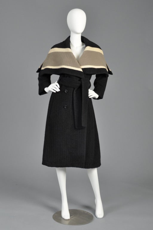 Spectacular ca. 1958 Christian Dior New York wool coat. Charcoal grey double breasted wool with the most massive striped cape-like shawl collar.  Slender, double-breasted, belted silhouette. Silk lining. Pristine vintage condition - no rips, tears,