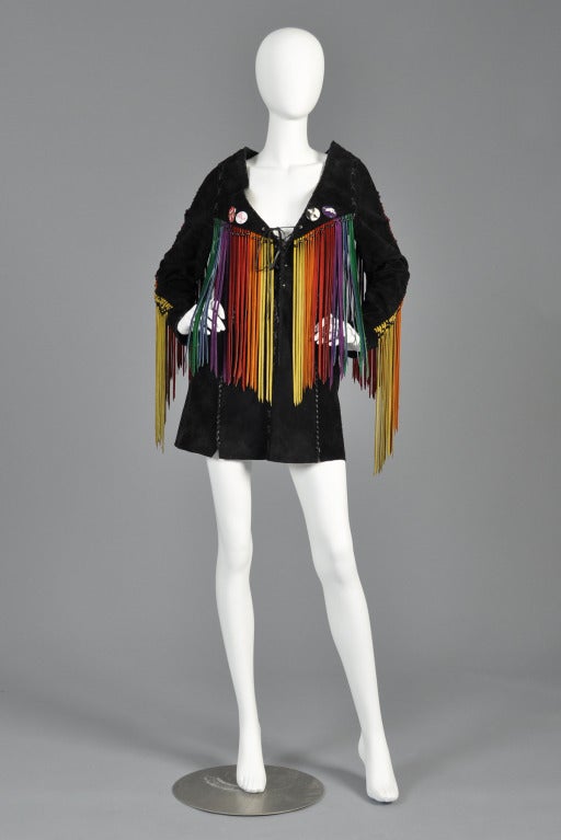 Truly amazing ca. 1968 one-of-a-kind, hand-made suede tunic with rainbow suede fringe. Pulled out of a Detroit estate, this item is an authentic late 1960s tunic belonging to a Detroit political activist. It still retains its original protest pins,