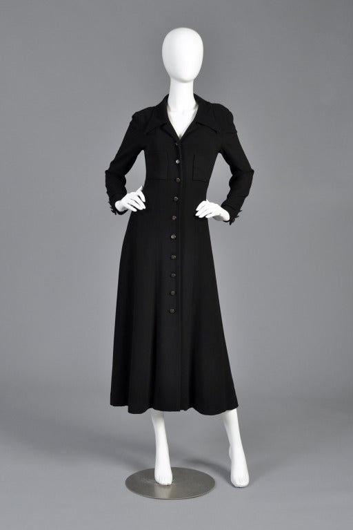 Amazing F/W 1993 Chanel maxi jacket dress. Absolutely awesome find. Waffle knit, lightweight wool outer with huge pockets, plunging neckline + logo buttons down the front + cuffs. Lined in silk. Easy to wear as a long jacket or buttoned closed as a