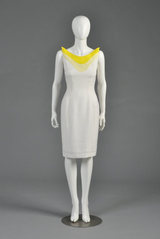 Fabulous 1990s Thierry Mugler ultra fitted white cotton cocktail dress. Killer lemon yellow architectural yoke that stands upright from the shoulders. Classic Mugler ultra fitted anatomical design. Super versatile and can easily translate from day