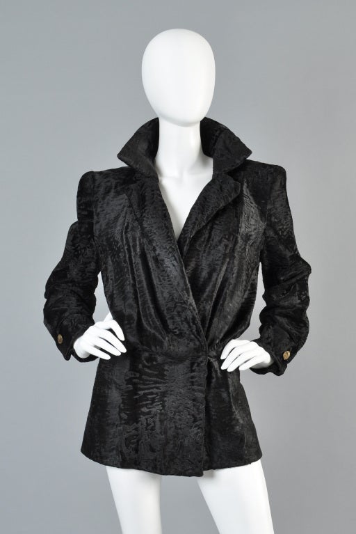 Spectacular 1980s James Galanos broadtail coat, made from genuine Swakara broadtail pelts. Truly the softest, silky broadtail we've ever had. INCREDIBLE avant garde construction with a killer fit!  Ultra fitted through the hips with nipped waist,