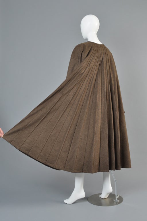 Spectacular F/W 1996/97 Claude Montana swing coat. Made of alpaca + wool bure. Ultra full pleated back with slit pagoda sleeves + single closure at the neck. Shown on the F/W 1996 runway in this color and also on page 158 of 