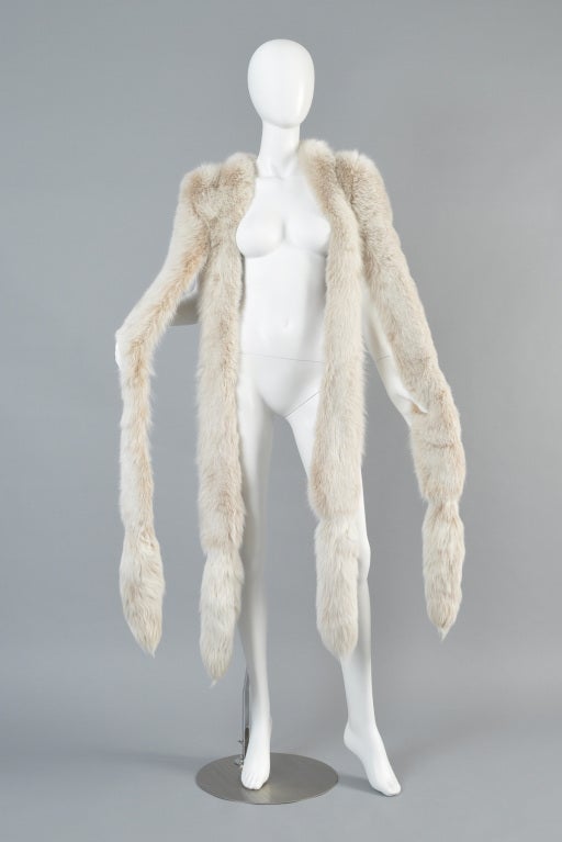 Spectacular + extremely rare Oscar de la Renta blush fox fur scarf. Incredible piece! We are lovers of anything with tails on it but we have NEVER had a piece like this before! Stunning pale blush-colored tendrils with fox tails on the end of each.