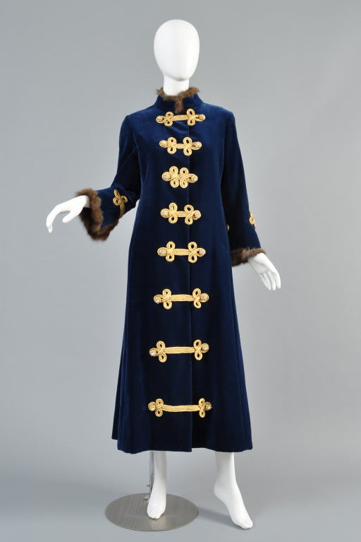 Extremely rare Sergeant Pepper inspired 1968 Bill Blass for Maurice Rentner evening coat. Long dark imperial blue velvet with flared hem + belled sleeves. Metallic gold soutache braided closures up the front with large rhinestone buttons. Nehru