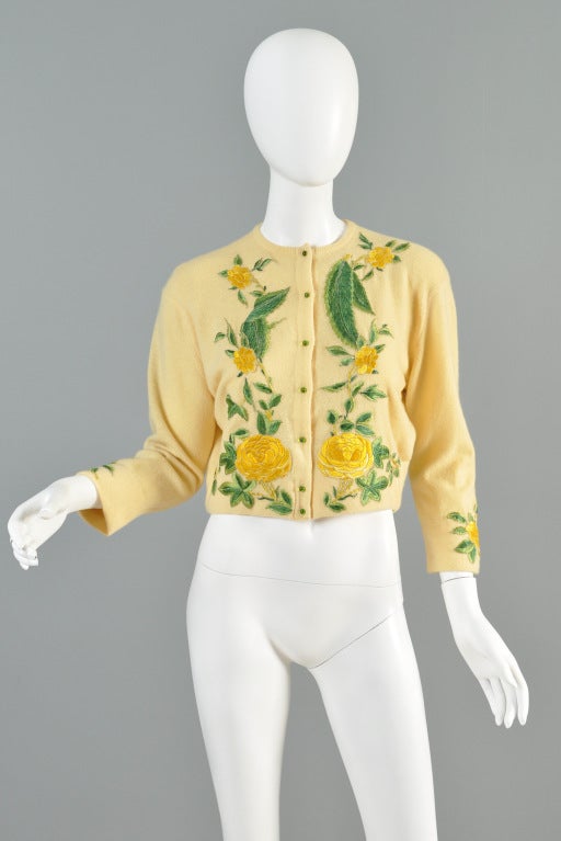 Spectacular 1950s Helen Bond Carruthers cashmere cardi. Classic HBC design. Pale yellow cashmere with appliquéd  florals. Turned back cuffs + hem with sheer silk lining. Tiny pale green buttons. Amazing find! Excellent condition! Looks unworn!
