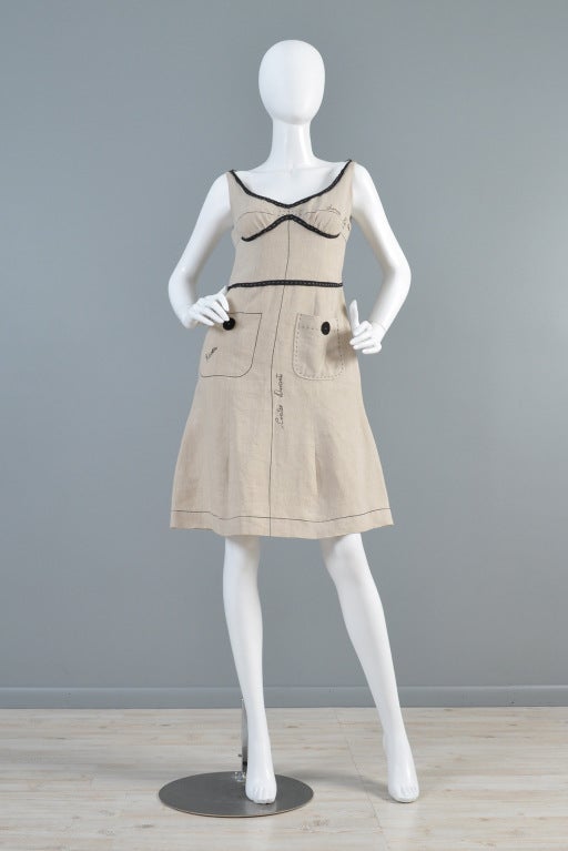 Ultra adorable + fun vintage Moschino Ceci N'Est Pas Haute Couture sloper dress. Coveted Moschino whit at its finest! Linen mock-up/sloper a-line dress complete with tacked on hem tape, one real + one drawn on pocket + Italian pattern directions