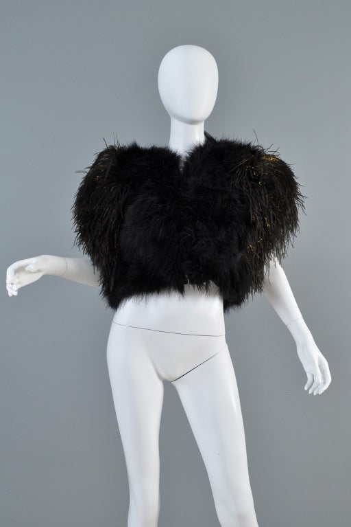 Lovely 1970s Bill Tice ostrich feather + marabou bolero. Incredible piece! Black marabou body with ostrich feather trim around the arm holes. Also has strands of metallic gold running through the ostrich feathers. Understated chic - easy to style