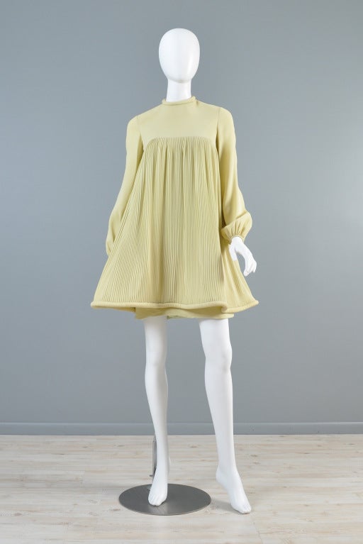 Spectacular vintage c. 1967 Pierre Cardin silk mini dress. Pale greenish yellow pleated silk with puffed sleeves, full tent shape + skinny fitting attached mini skirt beneath! Such a lovely little find - just in time for