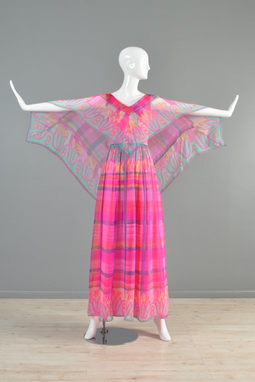 Beautiful 1970s/early 80s Ruben Panis silk gown. INCREDIBLE piece. Sheer hand-painted silk chiffon with plunging neckline + butterfly wing cape back. Truly a rare + stunning find!

MEASUREMENTS
Bust: 32