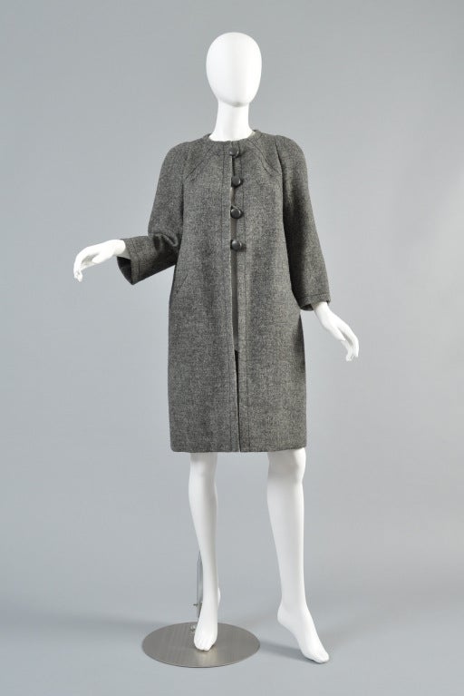 Beautiful spring/summer 1963 Marc Bohan for Christian Dior haute couture wool jacket. Exceptionally rare find! Charcoal grey lightweight mottled wool. Classic high rounded neckline, top stitched details, bracelet length sleeves + besom pockets.