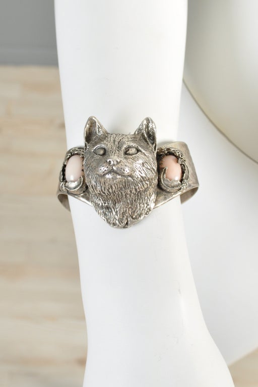 Incredible Bob Stringer sterling silver cat head bracelet. Incredible piece! Larger sized, entirely sterling, one-of-a-kind piece. Oversize cat face is flanked by moon stones on either side. Seriously awesome!

MEASUREMENTS
Length: 2.25