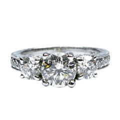 1.76 carats H SI1 Round Brilliant 3-Stone Engraved Ring 3