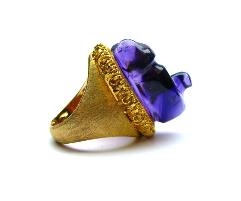 Exquisite Buccellati signed 18kt yellow gold engraved ring featuring a stunning free-form 26.62ct amethyst center stone. This piece is as unique as the woman who wears it.