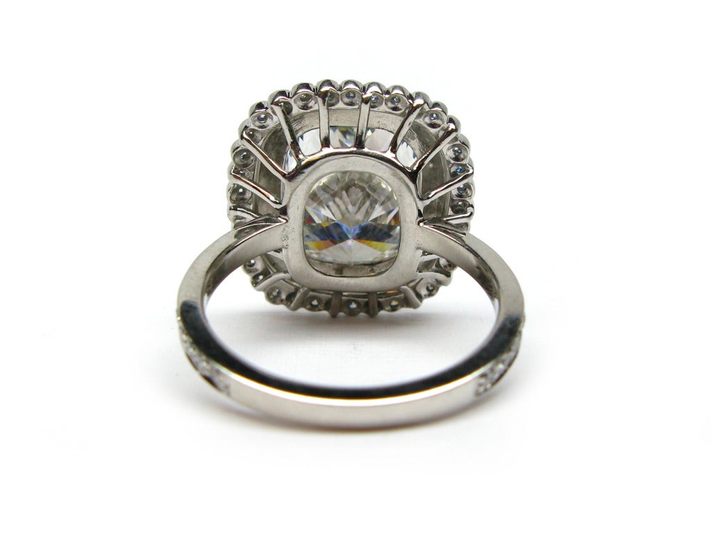 Contemporary 6.01ct Cushion cut diamond set within Double Pave Frame Ring