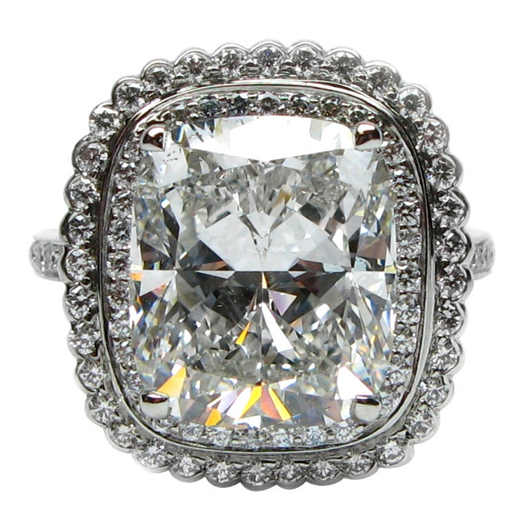 6.01ct Cushion cut diamond set within Double Pave Frame Ring