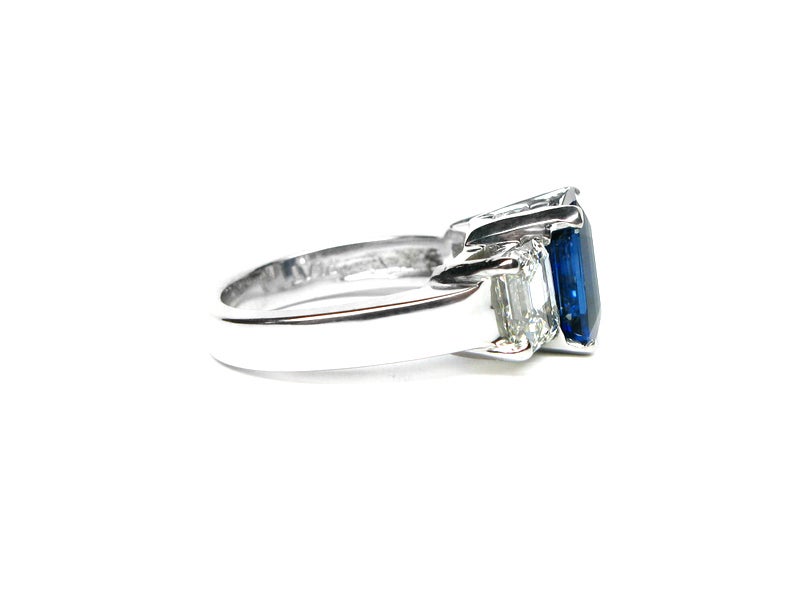 This 3.42 carat vivid blue sapphire is set in platinum and accompanied by two emerald cut diamonds weighing approximately 1.25ctw . This is the perfect alternative to the classic engagement ring. Just like the special someone you are shopping for,