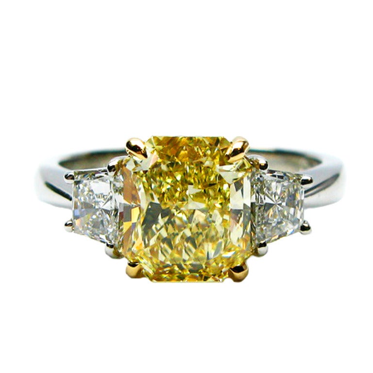 2.01 carat GIA Fancy Yellow Radiant Diamond ring With Trapezoid Cut Diamonds