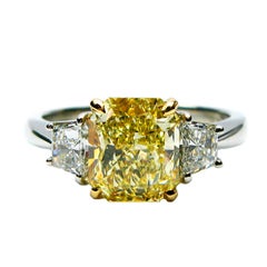 2.01 carat GIA Fancy Yellow Radiant Diamond ring With Trapezoid Cut Diamonds