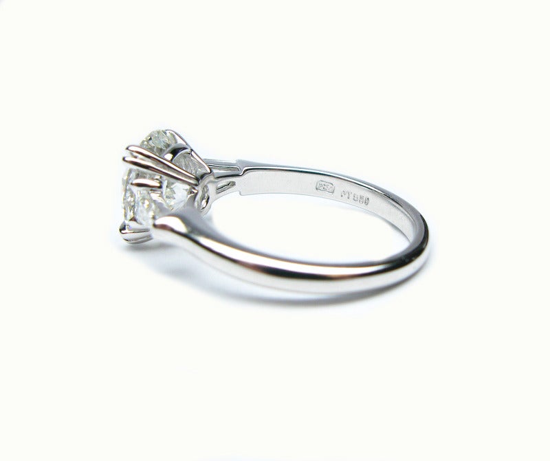 classic winston cushion-cut engagement ring with tapered baguette side stones