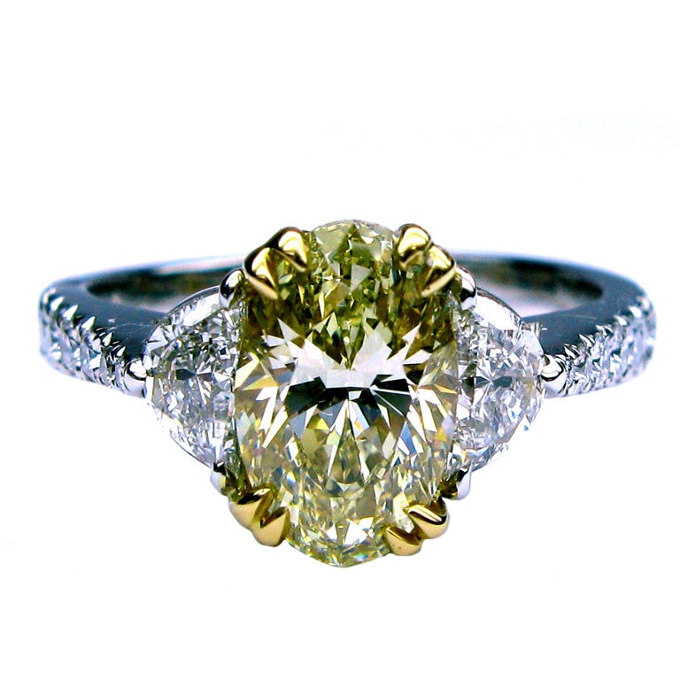 1.52ct GIA Fancy Yellow VVS2 Oval and Halfmoon Ring