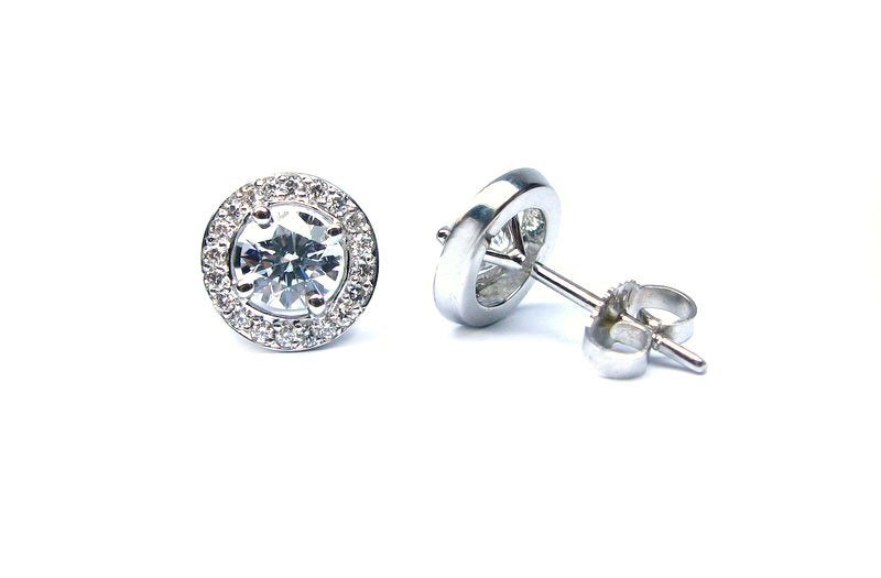 From J. Birnbach, these half carat diamonds (1.03 cts total) are surrounded by a frame of pave diamonds totaling 0.30cts.