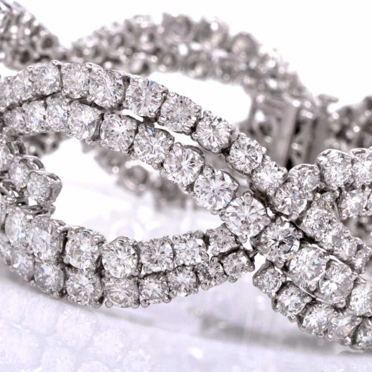 This gorgeous and sparkling diamond bracelet circa 1940's is the perfect adornment for any special occasion. Finely hand crafted in solid platinum, it features a beautiful spiral design that is accented with 210 genuine round cut brilliant diamonds