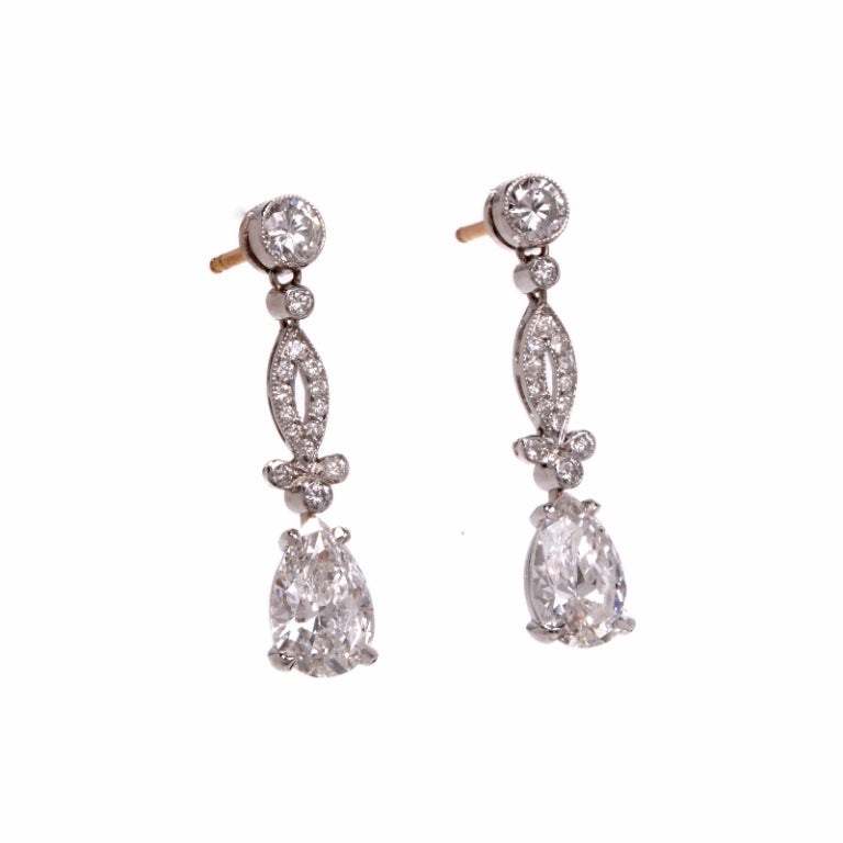 Elegant and luxurious, these sparkling diamond drop earrings are truly special, perfect for adding shine and luminescence to any ensemble. Finely crafted in solid platinum, these earrings feature 2 genuine pear shaped earrings, full of sparkle and