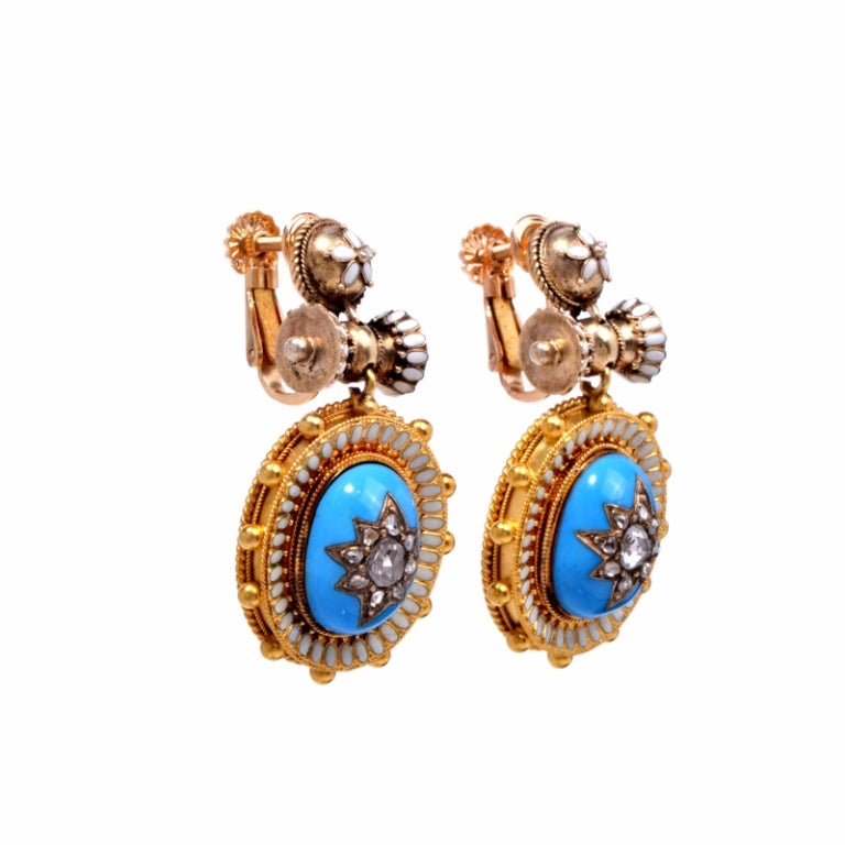These rare antique earrings are full of exquisite details and presentation. Finely crafted in solid 18K yellow gold, these earrings feature a gorgeous Victorian era enamel work. They are accented with 18 genuine old rose cut diamonds approx. 0.70ct,