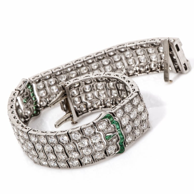 This stunning antique Art Deco bracelet is crafted in solid platinum. This bracelet is accented with some 183 genuine round European cut diamonds approx 16.00ct in total, G color, VS clarity. There are some 20 calibrated French cut genuine Colombian