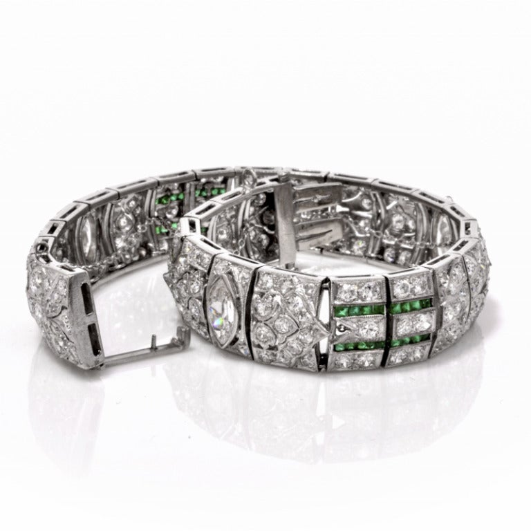 This sparkling antique Art Deco diamond emerald bracelet is a delight to behold! Finely crafted in solid platinum, this bracelet is bezel set with 3 exquisite genuine marquise cut diamond approx. 3.00ct, I in color, VS2 clarity and is embellished