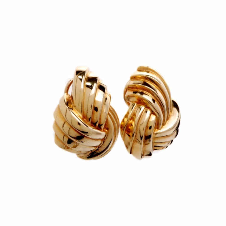 These beautiful  earrings are finely crafted in solid 18K yellow gold. They feature a classic knot design consisting of 4 strands and are made for non-pierced ears. These gorgeous earrings remain in excellent condition!!

Weight is approx: 23.4