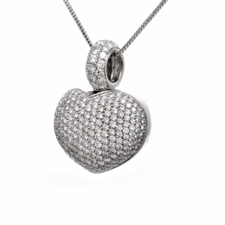 A timeless and classic design makes this heart pendant enduring and a must have piece. This estate Designer Gioiel Moda 18K white gold heart pendant is set with 228 genuine round cut dazzling diamonds approx 12.00ct, G-H color, VS clarity, all prong