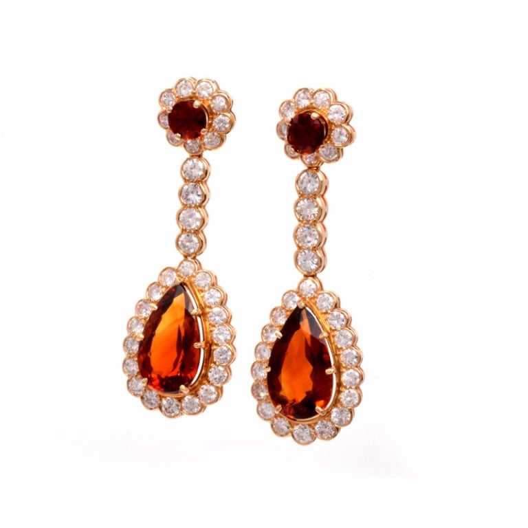 These divine estate drop dangle earrings are crafted in solid 18K yellow gold. These earrings are sure to make a statement and catch the eye, featuring 62 genuine round cut radiant diamonds approx. 7.50 cttw, G-H color, VS clarity . Set with two