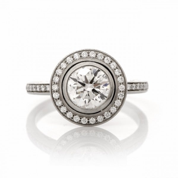 This exquisite Art Deco style diamond engagement ring is an authentic piece of Cartier d'Amour  collection, bearing the authentic hallmark of France and the item's Ref. # 2443. This popular collection was introduced by Maison de Cartier in late