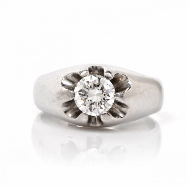 This authentic vintage men's solitaire  ring with a high grade round-faceted diamond is crafted in solid platinum and weighs approx. 17.6 grams. In distinguished, discretely ornate vintage style, this solitaire platinum ring exposes a genuine 1.03ct